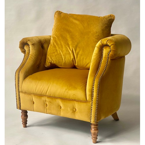 127 - TUB ARMCHAIR BY ALEXANDER & JAMES, bow backed studded and buttoned mustard yellow velvet with scroll... 