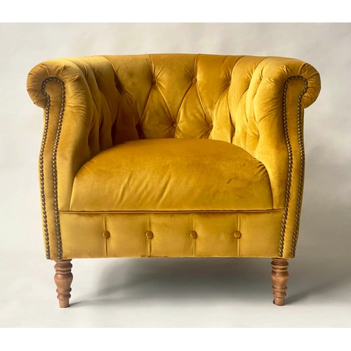 127 - TUB ARMCHAIR BY ALEXANDER & JAMES, bow backed studded and buttoned mustard yellow velvet with scroll... 