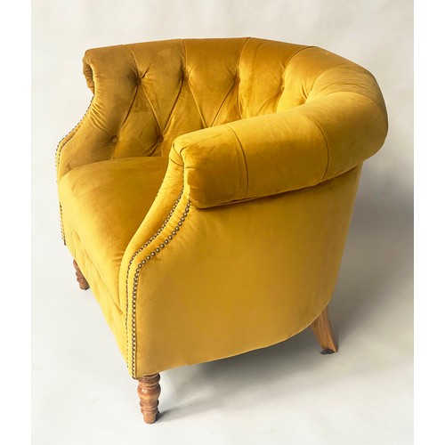 127 - TUB ARMCHAIR BY ALEXANDER & JAMES, bow backed studded and buttoned mustard yellow velvet with scroll... 