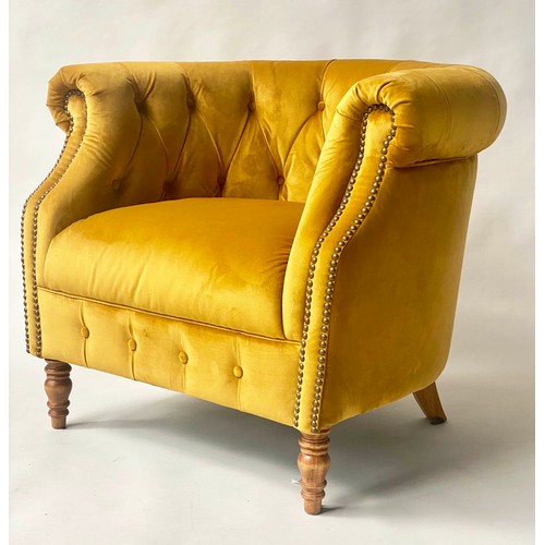 127 - TUB ARMCHAIR BY ALEXANDER & JAMES, bow backed studded and buttoned mustard yellow velvet with scroll... 