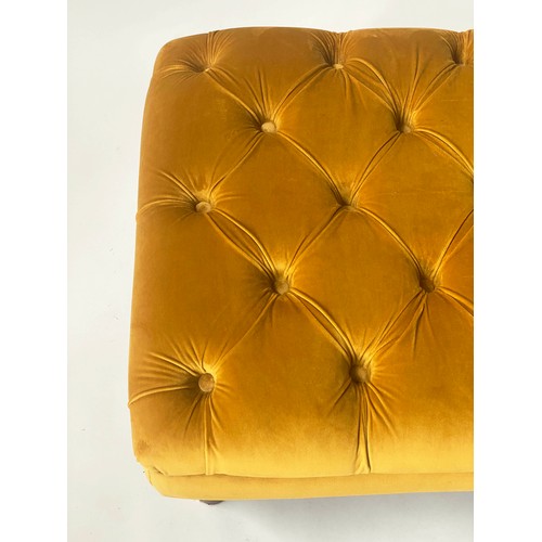 128 - FOOTSTOOL BY ALEXANDER & JAMES, rectangular buttoned studded mustard yellow velvet and turned suppor... 