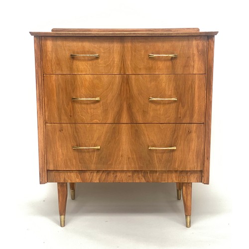 135 - CHEST, 1970s figured walnut with three drawers and splay brass tipped tapering supports, 64cm x 42cm... 