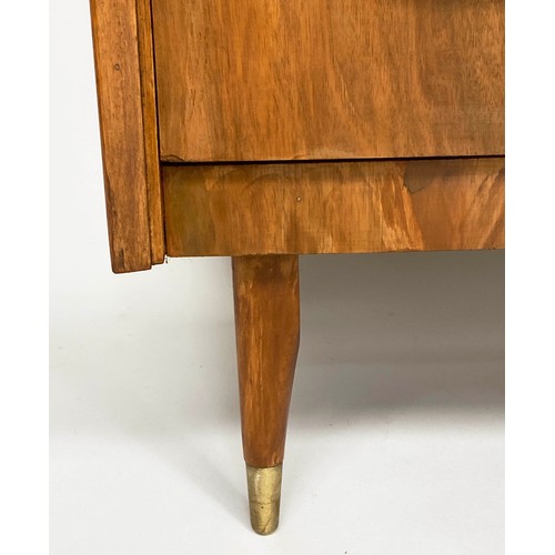 135 - CHEST, 1970s figured walnut with three drawers and splay brass tipped tapering supports, 64cm x 42cm... 