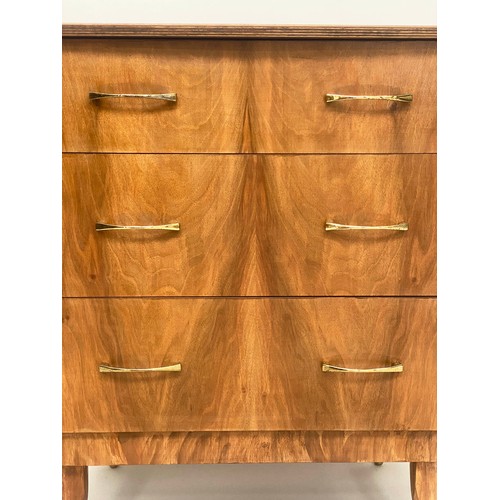 135 - CHEST, 1970s figured walnut with three drawers and splay brass tipped tapering supports, 64cm x 42cm... 