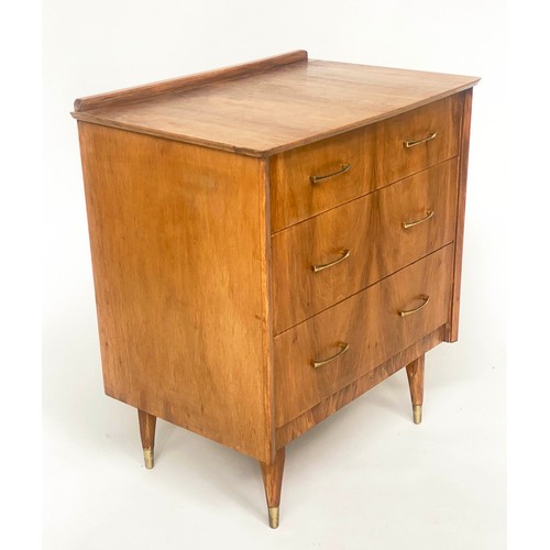 135 - CHEST, 1970s figured walnut with three drawers and splay brass tipped tapering supports, 64cm x 42cm... 