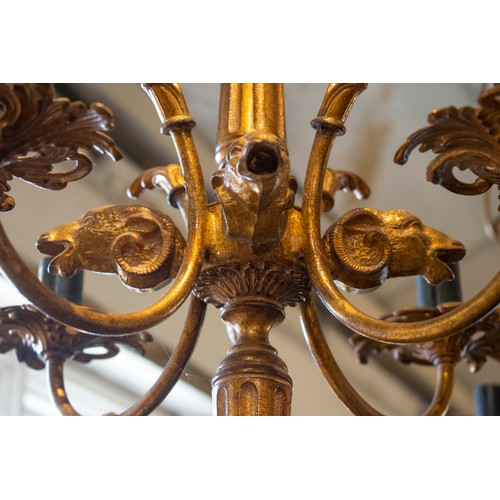 238 - CHANDELIERS, a pair, each 60cm H excluding chain x 45cm, ram's head detail in gilt metal with four l... 