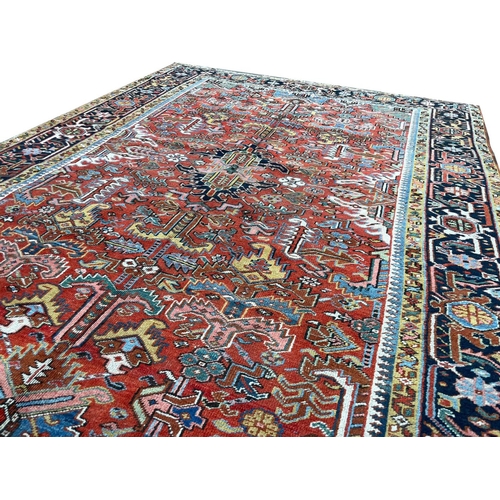 137 - ANTIQUE PERSIAN HERIZ CARPET, 295cm x 218cm.