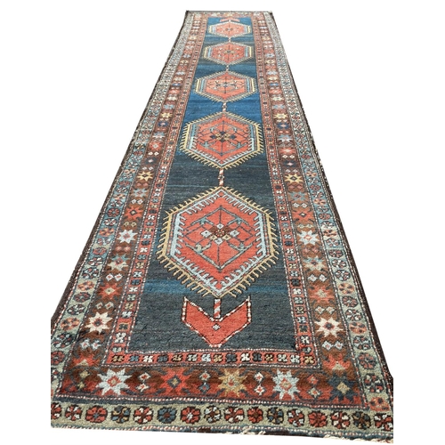 130 - ANTIQUE PERSIAN HERIZ RUNNER, 440cm x 95cm.