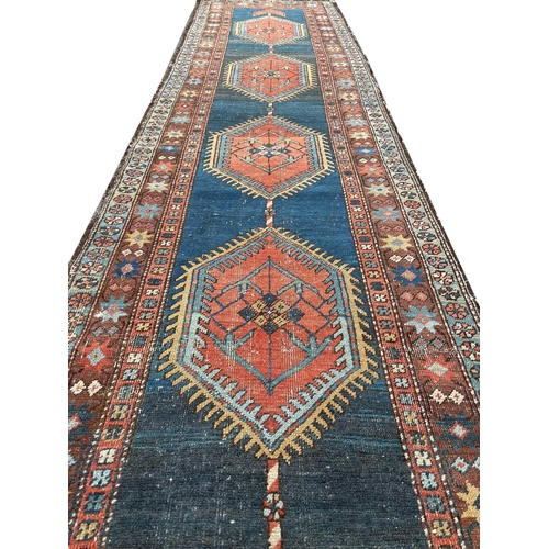 130 - ANTIQUE PERSIAN HERIZ RUNNER, 440cm x 95cm.