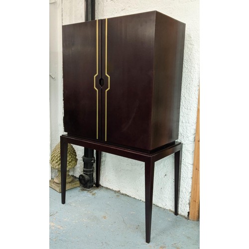 337 - JUSTIN VAN BREDA HUG CABINET, 100cm x 53cm x 166cm design on stand, mahogany veneer, brass inlay.