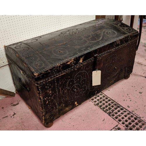 227 - TRUNK, 18th century leather bound and brass studded with hinged domed top dated 1735, iron handles a... 