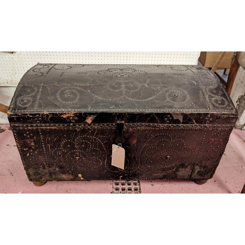 227 - TRUNK, 18th century leather bound and brass studded with hinged domed top dated 1735, iron handles a... 