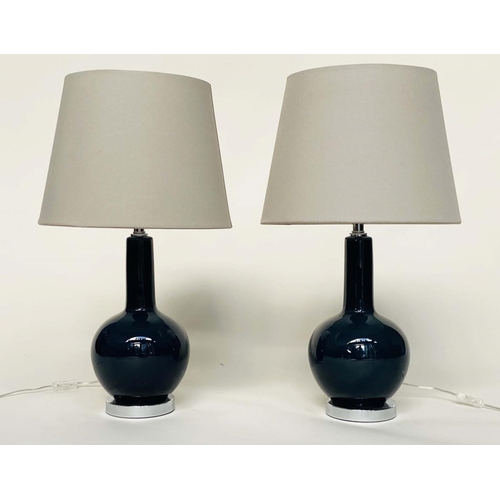 117 - OKA TABLE LAMPS, a pair, Grenadilla by Oka deep bottle green glass with shades, 74cm H. (2)