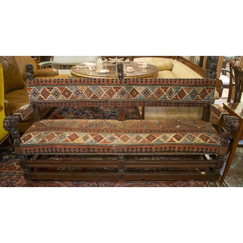 214 - SOFA, 98cm H x 183cm W x 63cm D, 19th century oak, with carved lion terminals and old carpet upholst... 