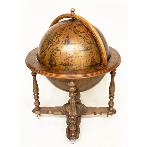 323 - GLOBE DRINKS CABINET, modelled as an antique terrestrial globe on stand with rising lid, 75cm x 100c... 