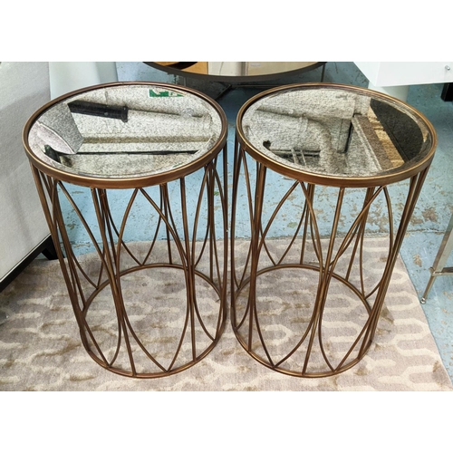 362 - SIDE TABLES, a pair, 40cm diam x 60cm, gilt metal with antiqued mirrored tops. (2)