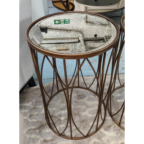 362 - SIDE TABLES, a pair, 40cm diam x 60cm, gilt metal with antiqued mirrored tops. (2)