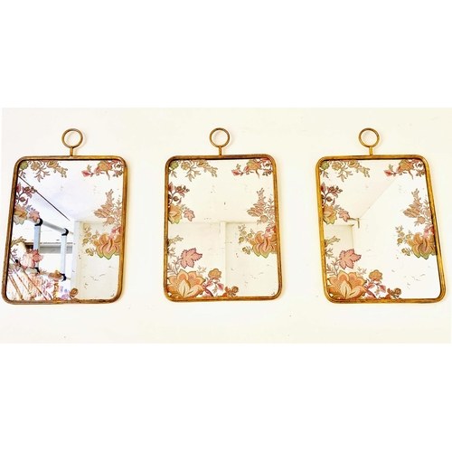 441 - WALL MIRRORS, a set of three, 1970s Italian style with floral detail, gilt metal, 64cm x 40cm.