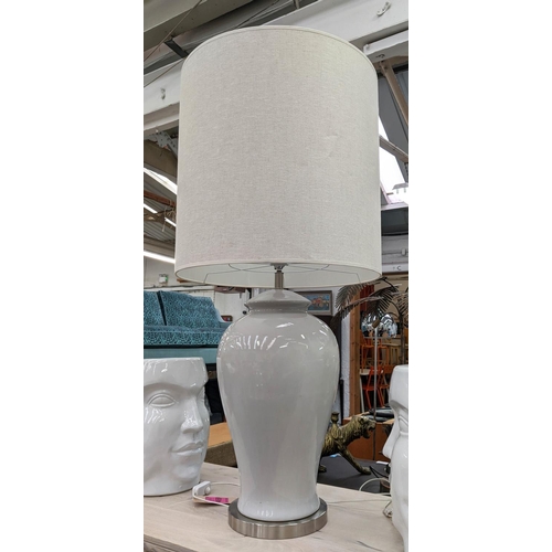 469 - CERAMIC LAMP, of outsize proportions, overall 130cm tall including shade.