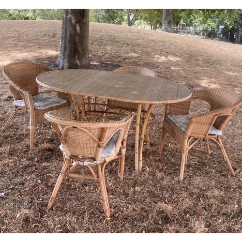 436 - DINING TABLE AND CHAIRS, 1950s oval wicker panelled, bamboo framed and cane bound with splayed suppo... 