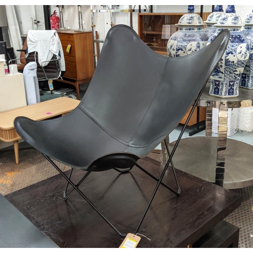 306 - CUERO DESIGN PAMPA MARIPOSA BUTTERFLY CHAIR, 87cm W x 94cm H with a black leather seat.