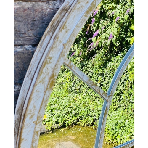 427 - ARCHITECTURAL GARDEN MIRRORS, a set of three, 160cm H x 67cm W, arched aged metal frames with overla... 