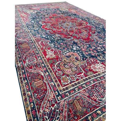 113 - ANTIQUE KERMAN LAVER CARPET, 510cm x 315cm.