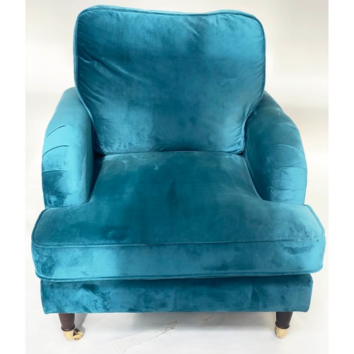 250 - ARMCHAIR, contemporary ocean blue velvet upholstery, with turned front supports and gilt metal casto... 