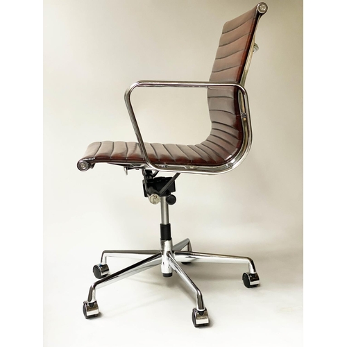 257 - REVOLVING DESK CHAIR, Charles and Ray Eames inspired ribbed mid tan brown leather revolving and recl... 