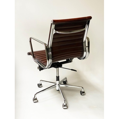 257 - REVOLVING DESK CHAIR, Charles and Ray Eames inspired ribbed mid tan brown leather revolving and recl... 