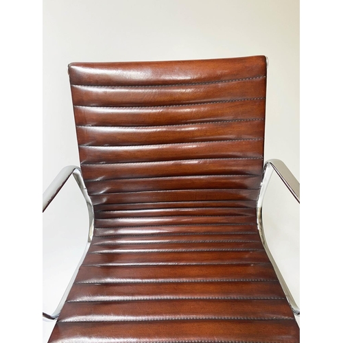 257 - REVOLVING DESK CHAIR, Charles and Ray Eames inspired ribbed mid tan brown leather revolving and recl... 