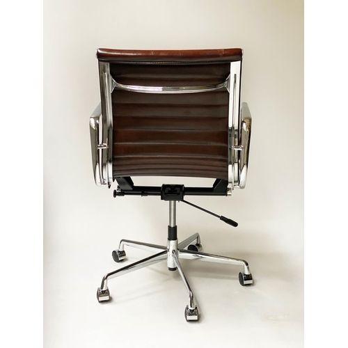 257 - REVOLVING DESK CHAIR, Charles and Ray Eames inspired ribbed mid tan brown leather revolving and recl... 