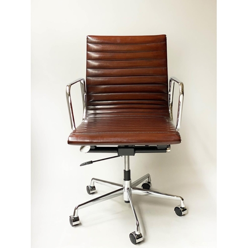 257 - REVOLVING DESK CHAIR, Charles and Ray Eames inspired ribbed mid tan brown leather revolving and recl... 