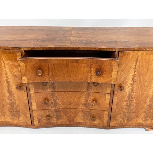 340 - SIDE CABINET, mid 20th century figured walnut with four concave drawers flanked by panelled doors, 1... 