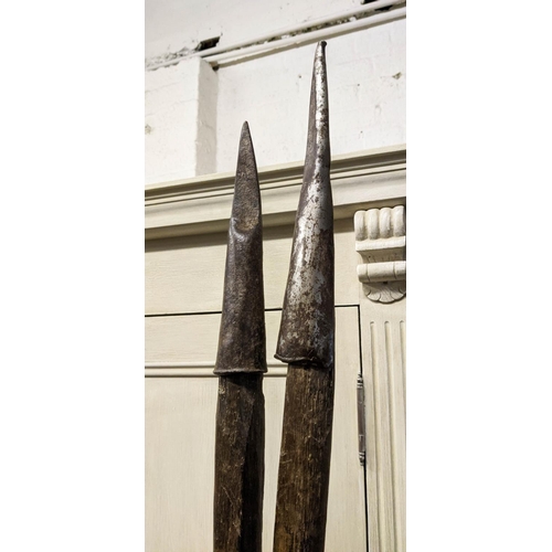 121 - SPEAR ON STAND, 202cm Long, wooden with metal and leather detail.