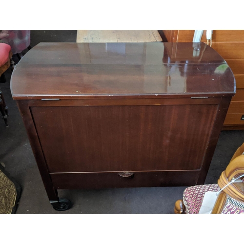 130 - COCKTAIL CABINET, 92cm x 82cm H x 46cm, mid 20th century mahogany with a rising bottle compartment o... 