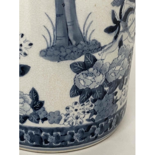 158 - STICK STAND, Chinese blue and white ceramic cylindrical with figures and palm trees, 45cm H.