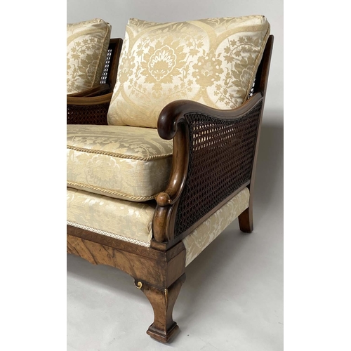 180 - BERGERES, a pair, early 20th century English walnut and gilt framed and cane panelled with silk broc... 