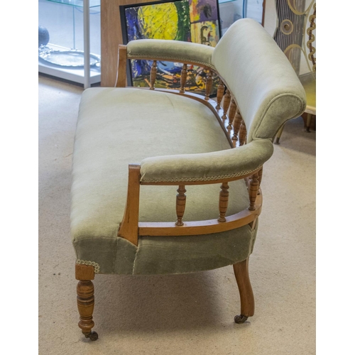 210 - SOFA, 70cm H x 140cm W, late Victorian walnut in green velour on ceramic castors.