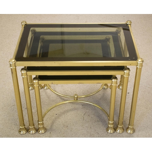 215 - NEST OF THREE TABLES, brass with tinted glass tops, largest 47cm H x 61cm x 40cm.