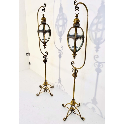 349 - LANTERNS ON STANDS, a pair, each 163cm high, 35cm across, in the Regency style, gilt metal frames (2... 