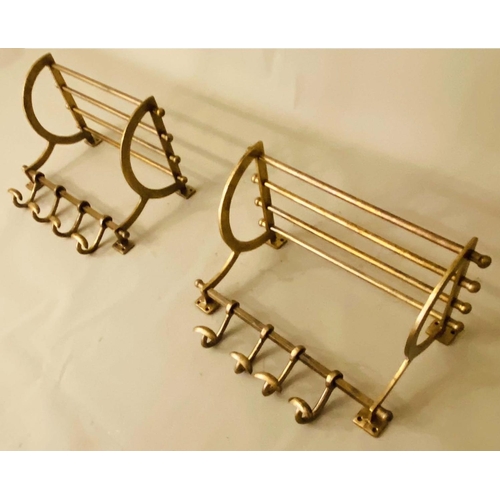 375 - WALL MOUNTING LUGGAGE RACKS, a pair, 35cm x 46cm x 27cm, gilt metal with run of coat hooks to the ba... 