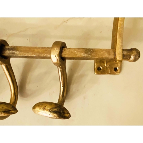 375 - WALL MOUNTING LUGGAGE RACKS, a pair, 35cm x 46cm x 27cm, gilt metal with run of coat hooks to the ba... 