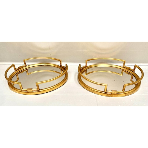 392 - COCKTAIL TRAYS, a pair, 1950s Italian style, gilt metal and mirror, 95cm x46cm. (2)