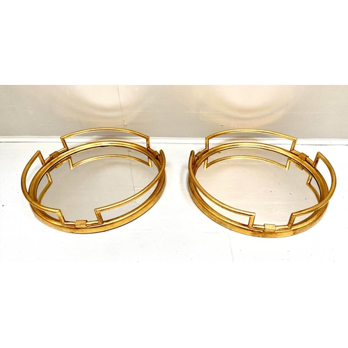 392 - COCKTAIL TRAYS, a pair, 1950s Italian style, gilt metal and mirror, 95cm x46cm. (2)