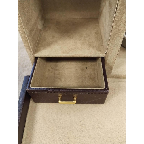 4 - TRAVELLING WHISKY CASE, brown leather with brass hardware, opening to reveal a fitted interior with ... 