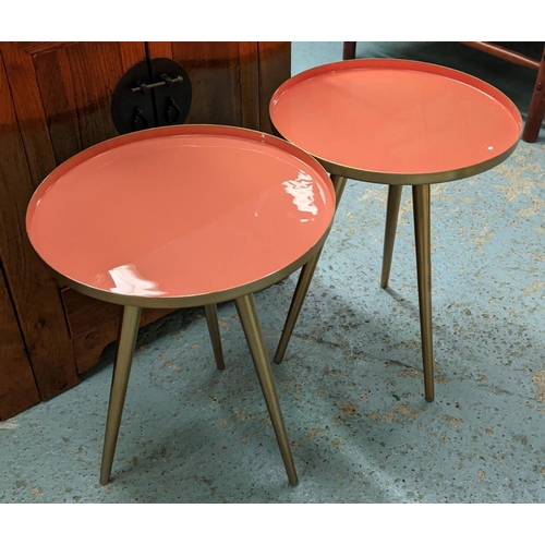 466 - SIDE TABLES, a pair, 49cm x 39.5cm diam, 1950's Italian style, orange lacquered tops. (2)