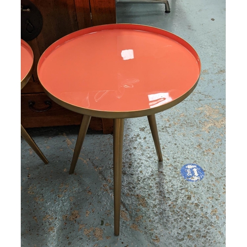 466 - SIDE TABLES, a pair, 49cm x 39.5cm diam, 1950's Italian style, orange lacquered tops. (2)