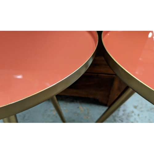 466 - SIDE TABLES, a pair, 49cm x 39.5cm diam, 1950's Italian style, orange lacquered tops. (2)