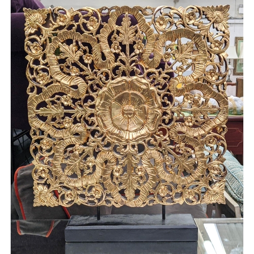 477 - DECORATIVE PANEL ON STAND, gilt finish, 60cm H.